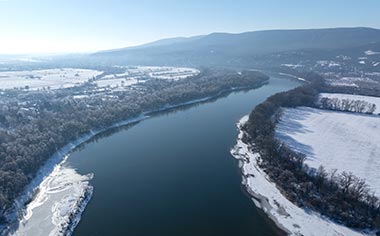 An aerial view over the Danube river in winter